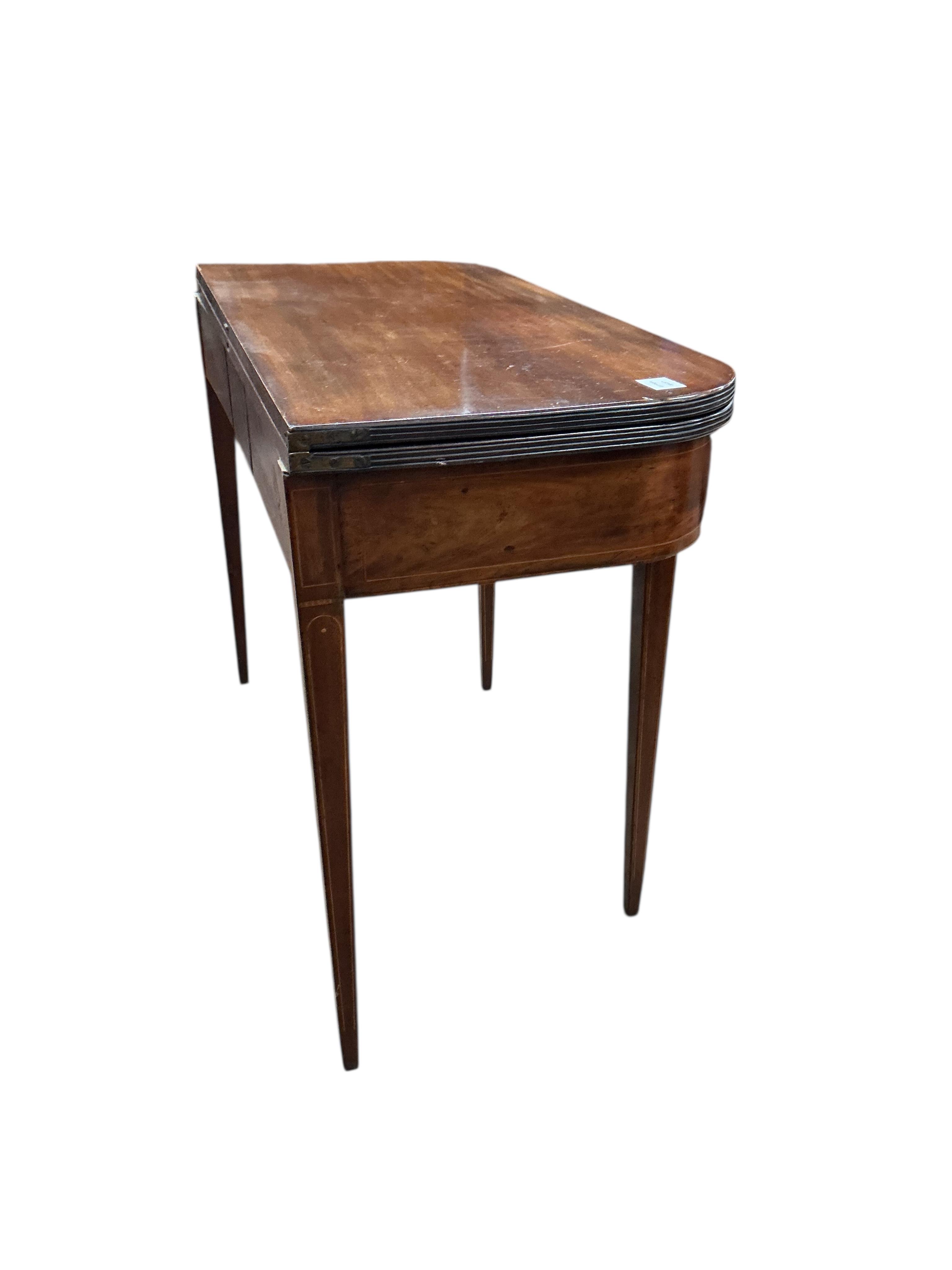 A George III mahogany D shaped folding tea table, width 97cm, depth 46cm, height 75cm